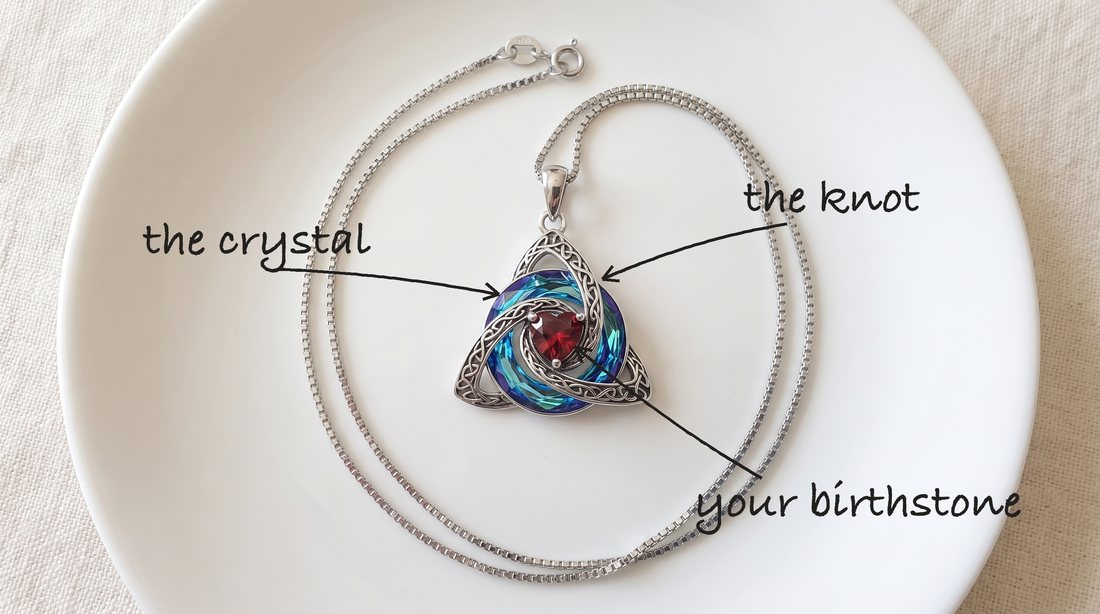 Close-up of the knot, the crystal and the garnet heart