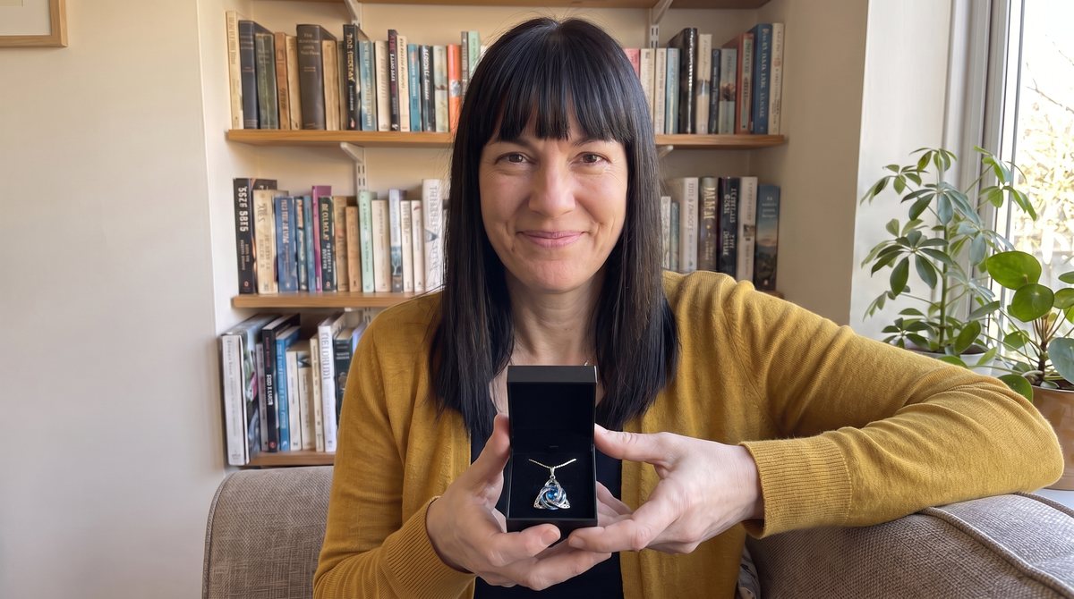 The author holding the necklace box