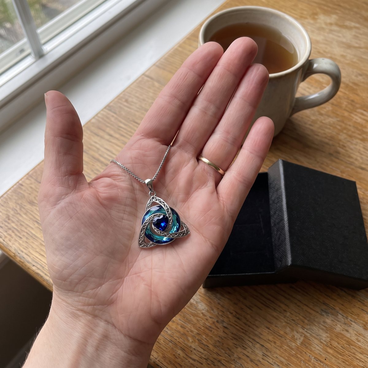 The pendant in an open palm