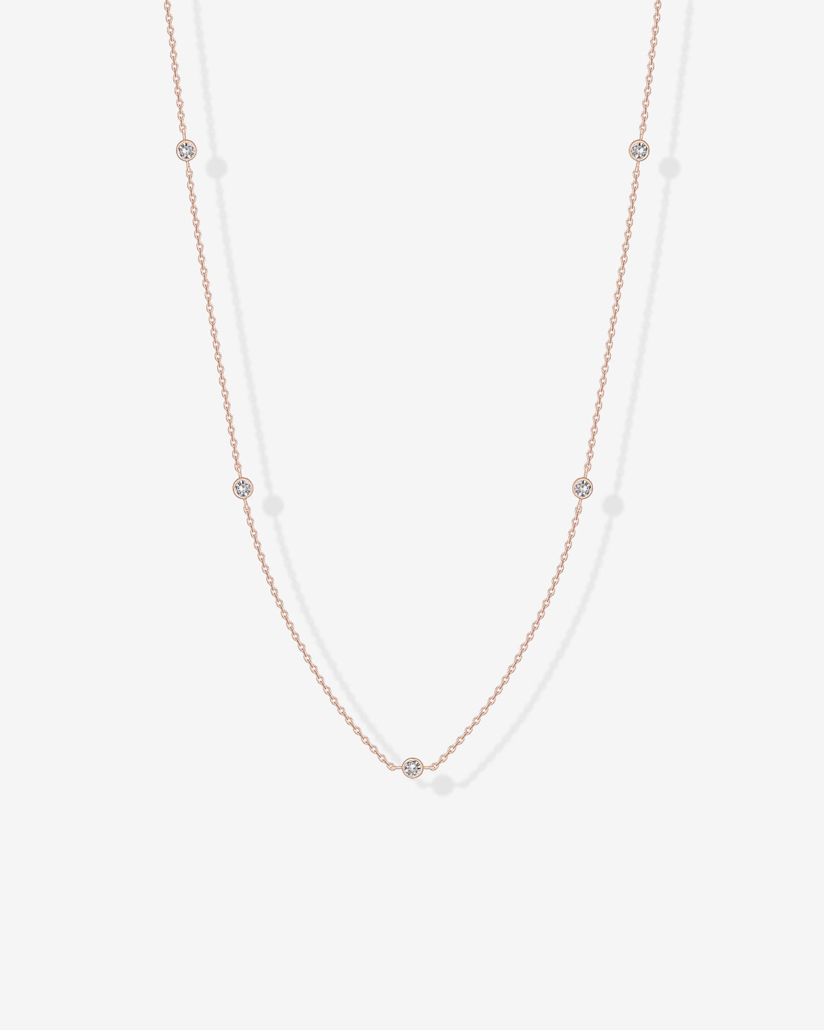 Avera diamond station necklace in rose gold - worn close up
