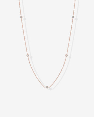 Avera diamond station necklace in rose gold - worn close up