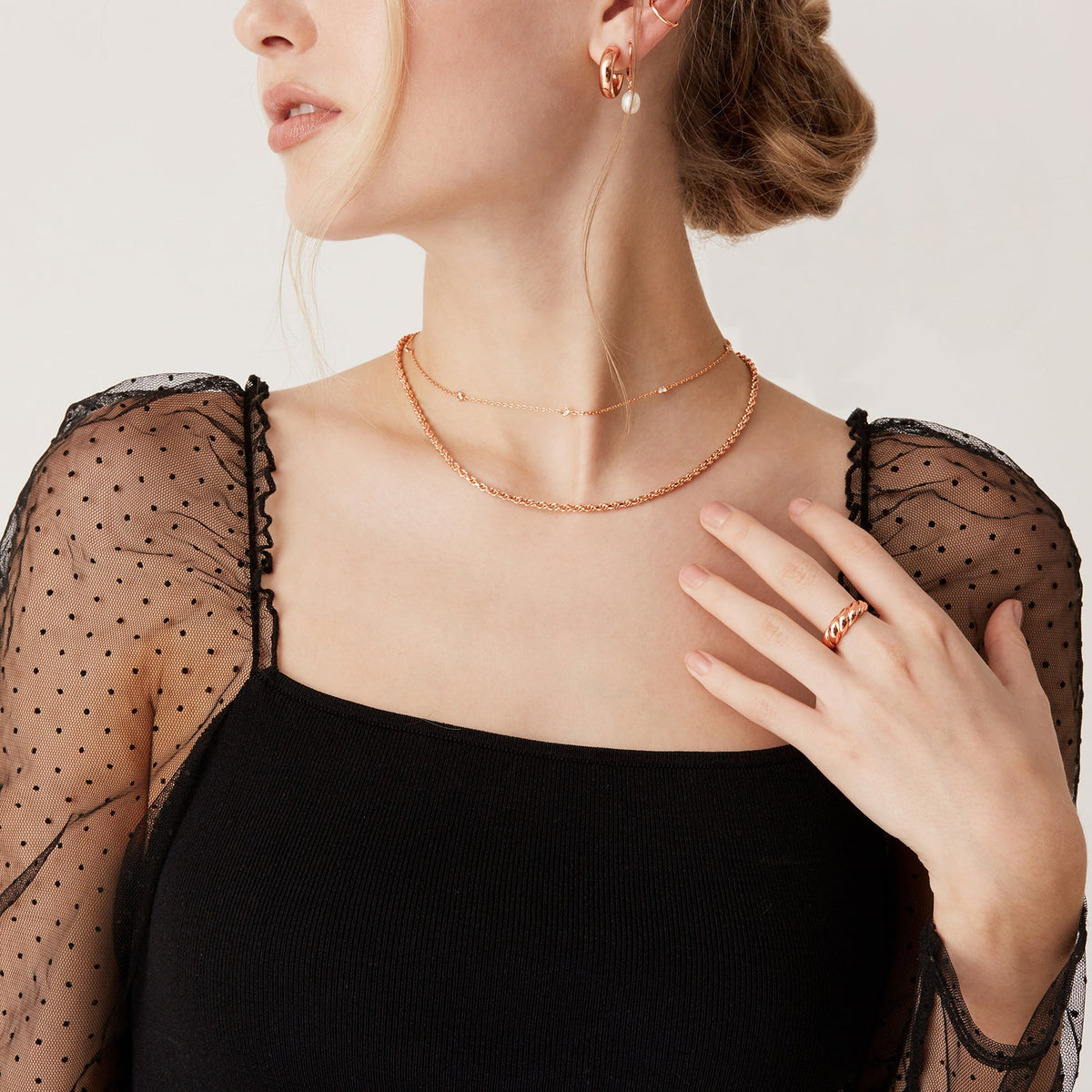 Avera diamond station necklace in rose gold - worn with a black dress