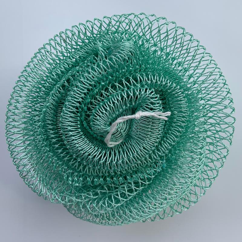 African exfoliating net in mint, rolled