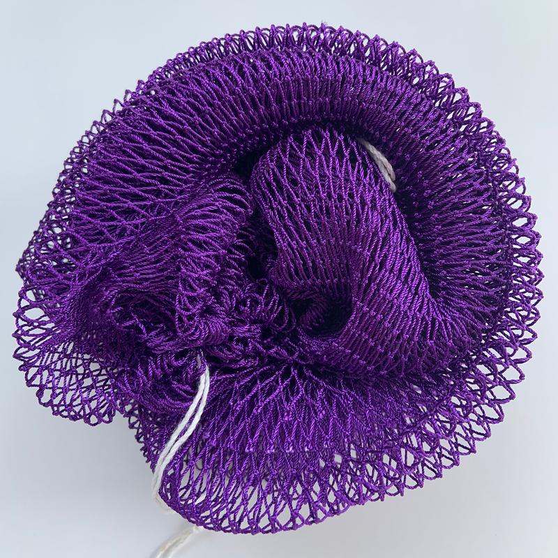 African exfoliating net in purple, rolled