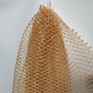 African exfoliating net in tan, hanging