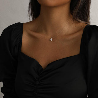 Pear floating pendant necklace worn on the neck