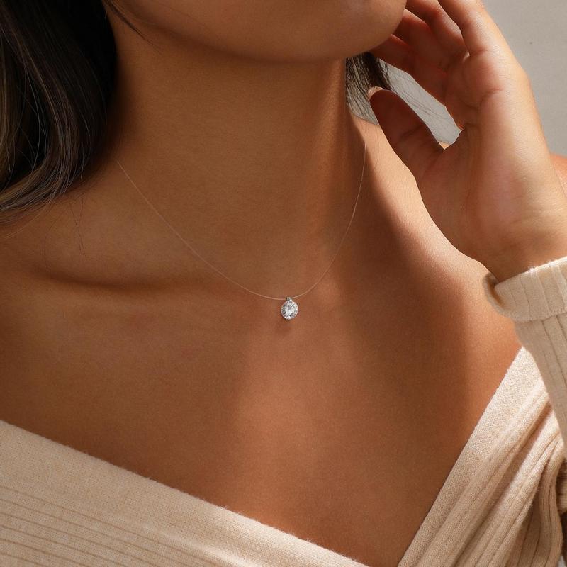 Oval floating pendant necklace worn on the neck