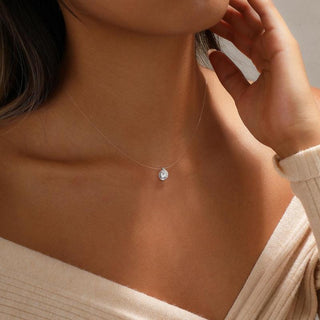 Oval floating pendant necklace worn on the neck