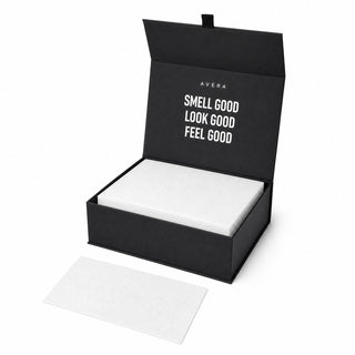 Avera Laundry Sheets gift box open with a neat stack of white sheets