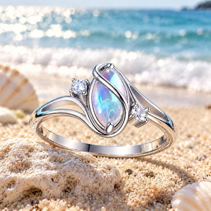 Avera Moonstone Ring resting on sand