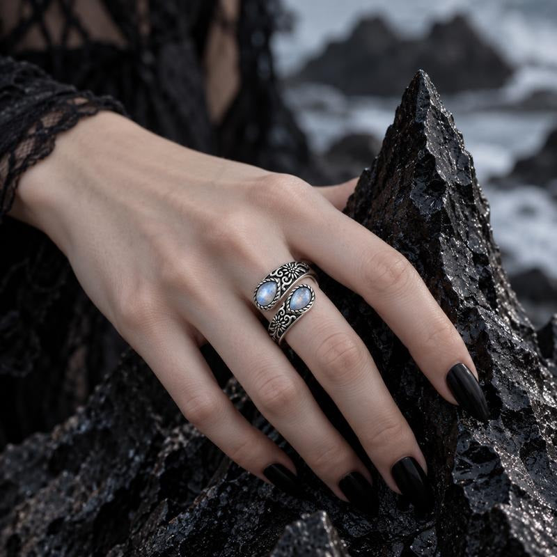 Moonstone thumb ring worn on the hand