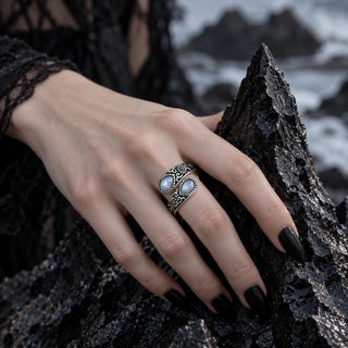 Moonstone thumb ring worn on the hand