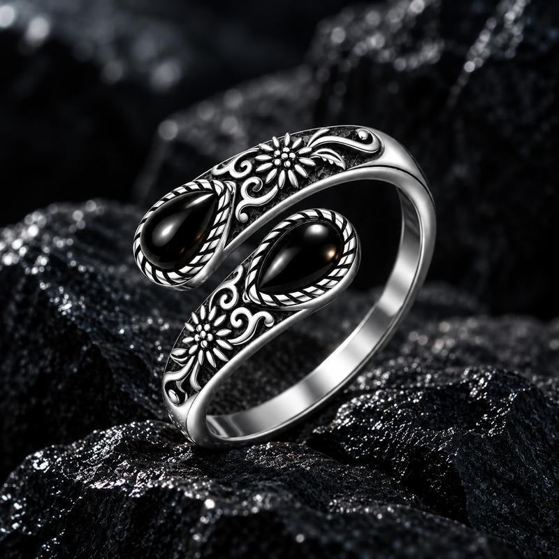 Black stone thumb ring with floral engraving