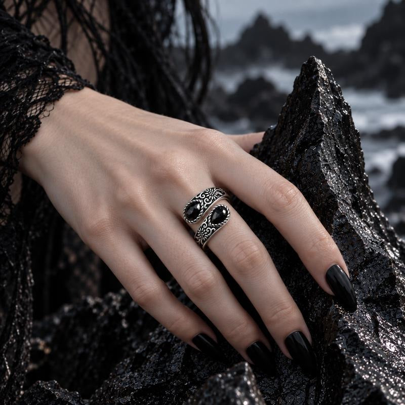 Black stone thumb ring worn on the hand