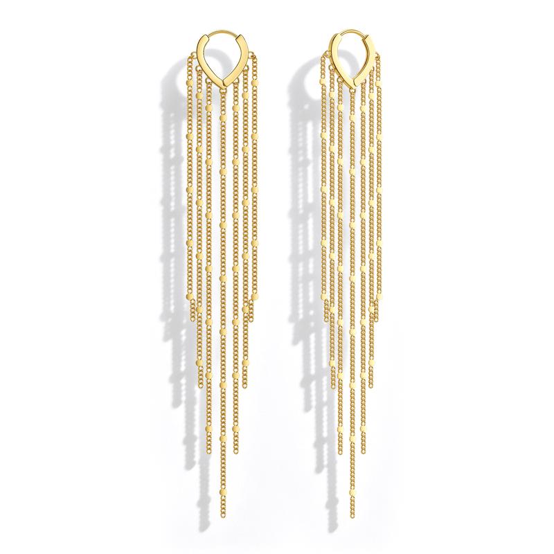Gold chain tassel earrings on white