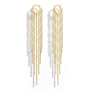 Gold chain tassel earrings on white