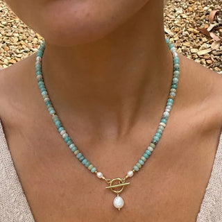 Turquoise Bead Pearl Necklace in gold with a freshwater pearl drop, worn close up