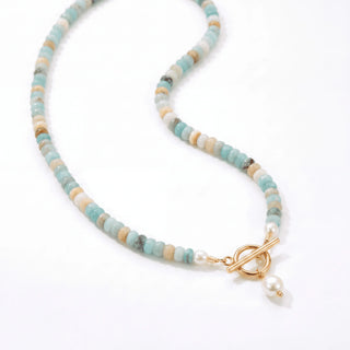 Close up of the gold toggle clasp and pearl drop on the Turquoise Bead Pearl Necklace