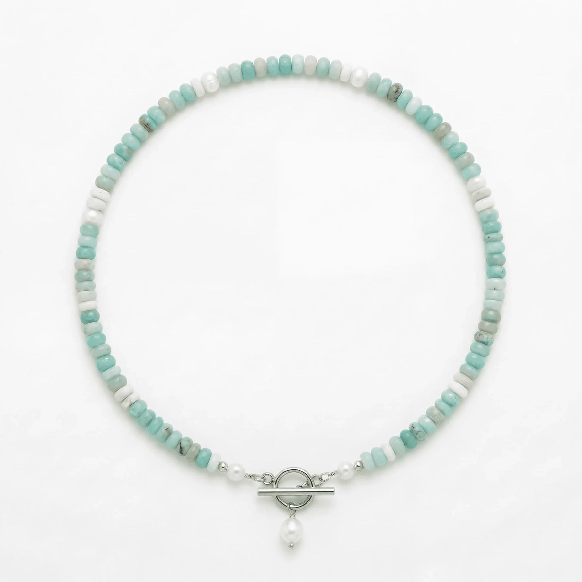 Turquoise Bead Pearl Necklace in silver laid flat on a white background