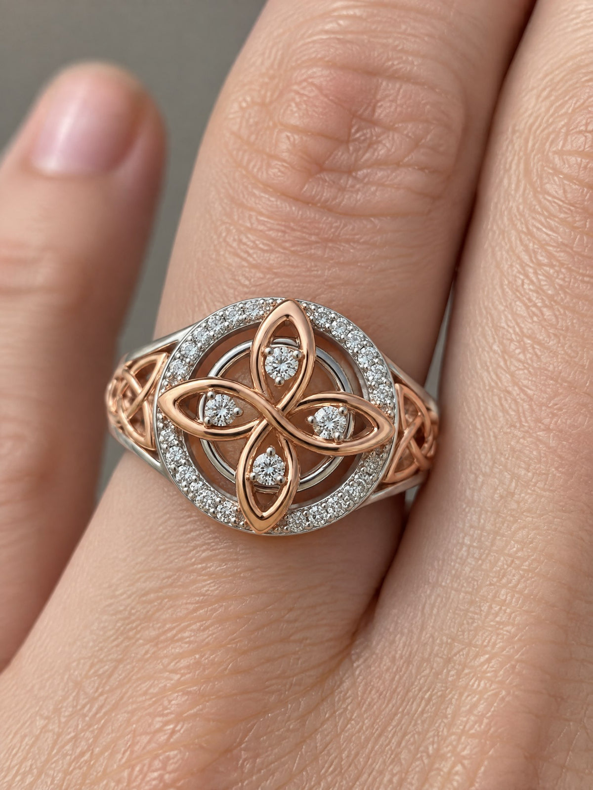 Rose gold, set in a halo of light