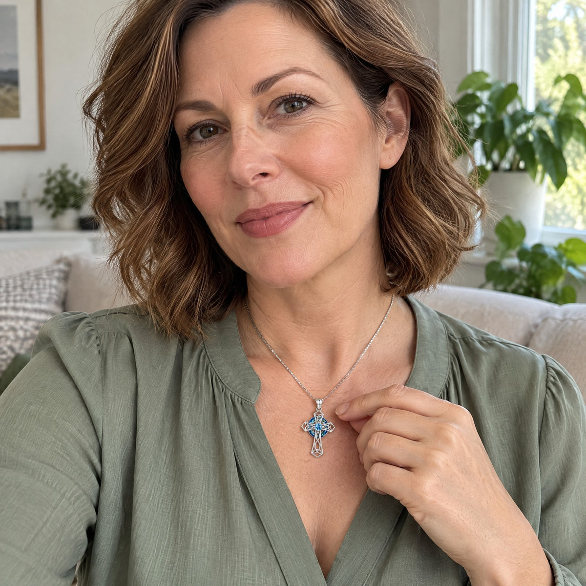 Celtic cross birthstone necklace worn at home