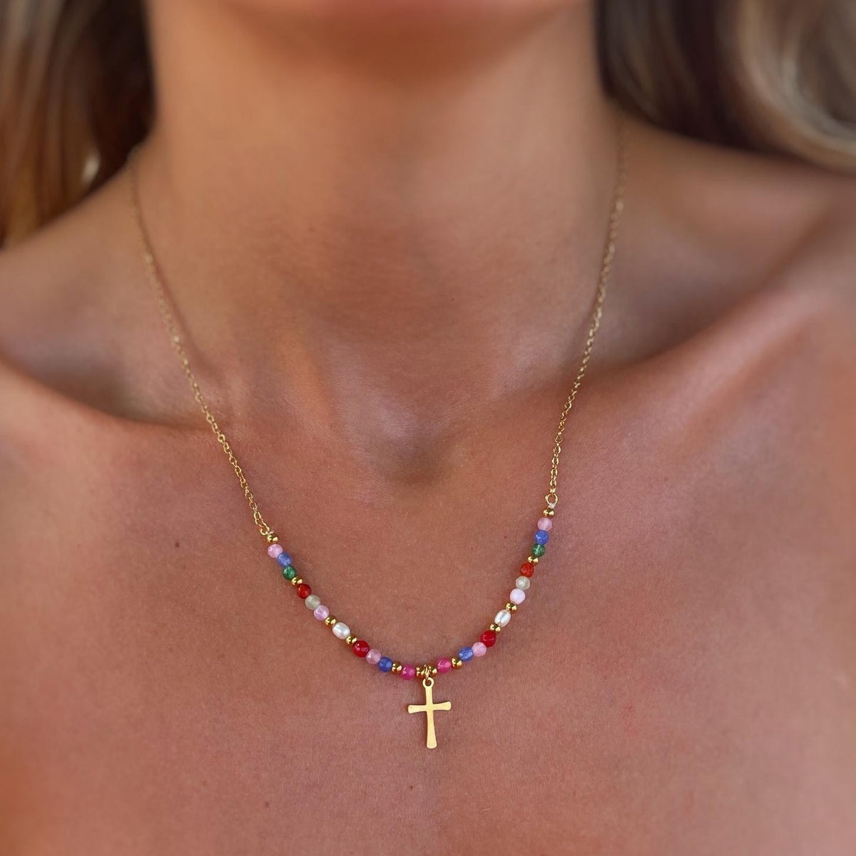 Gold Faith Cross Necklace on the collarbone