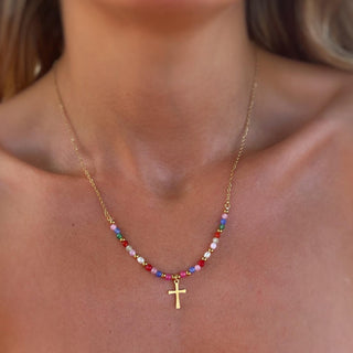 Gold Faith Cross Necklace on the collarbone