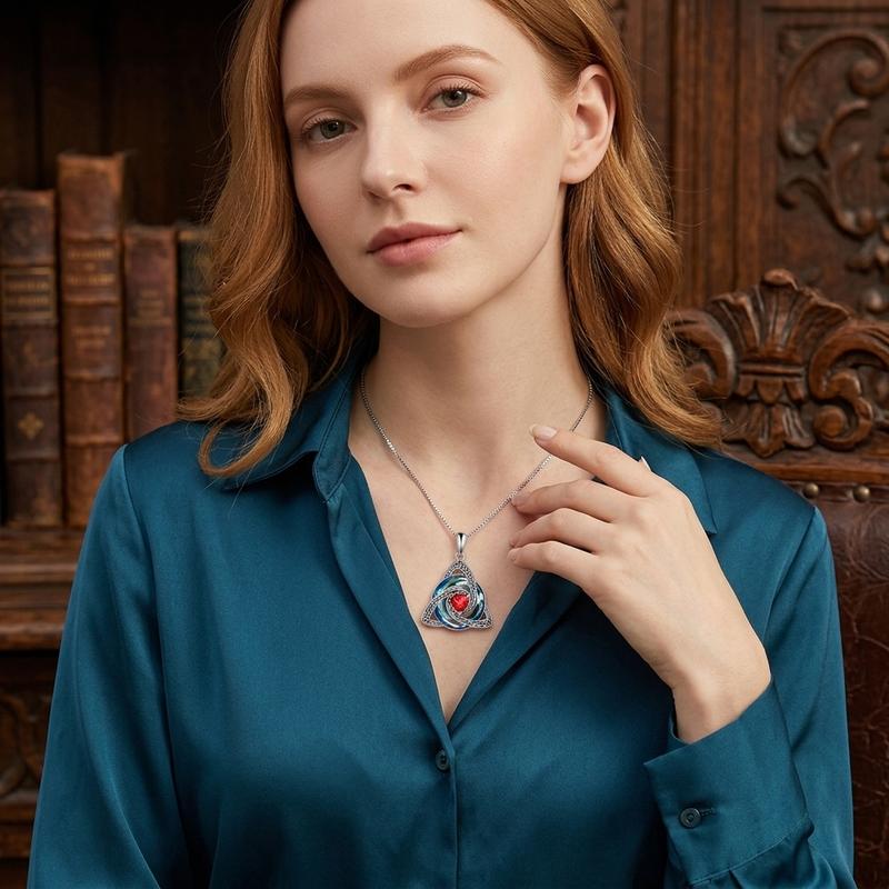 The necklace worn with a green blouse