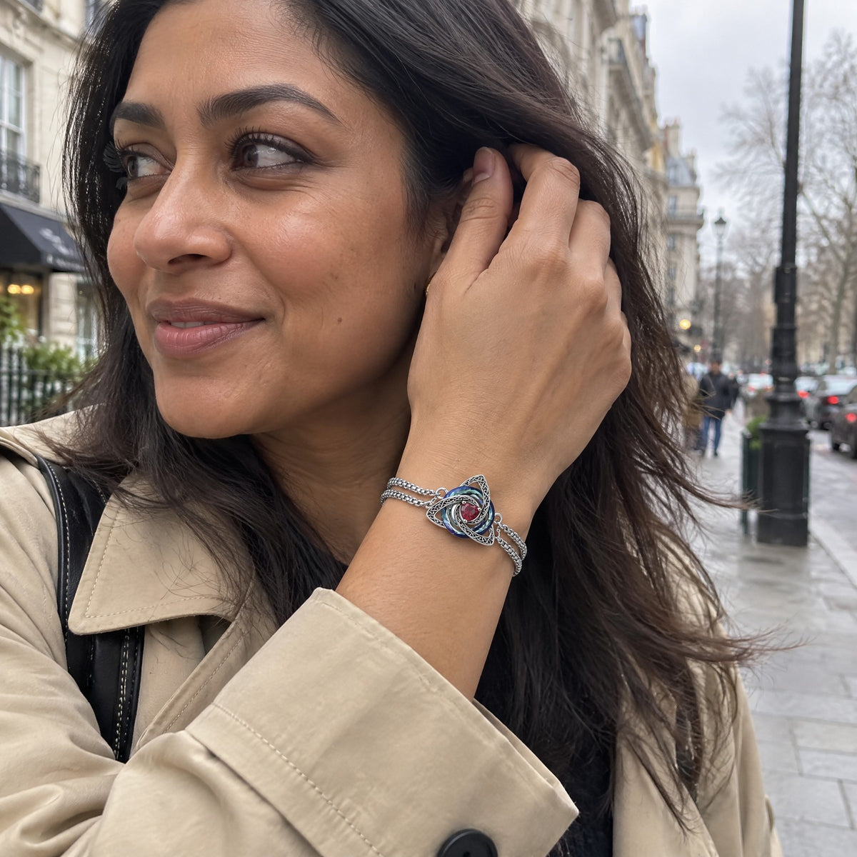 Woman in a city street wearing the witch knot birthstone bracelet